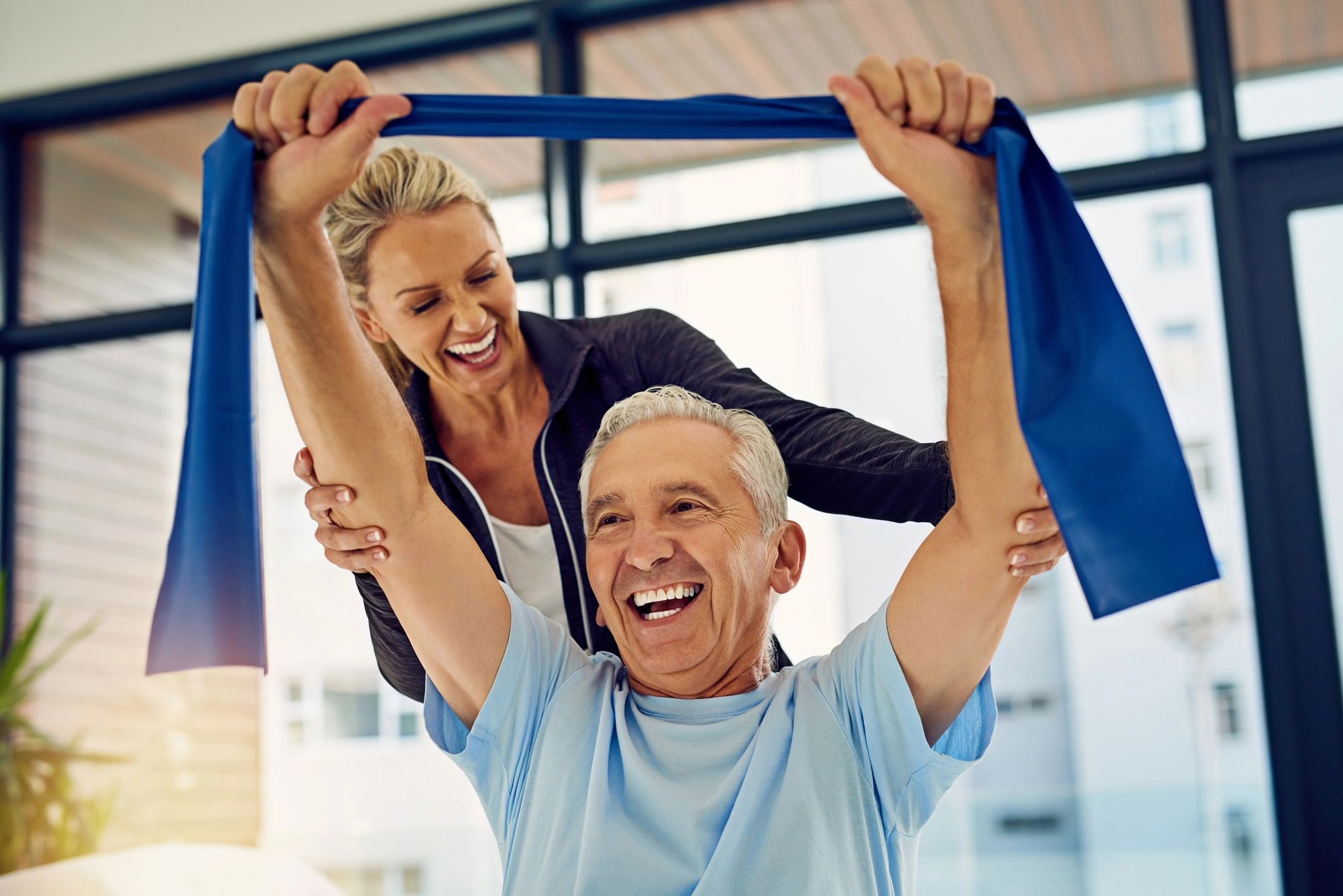 Shot of a physiotherapist helping a senior patient
